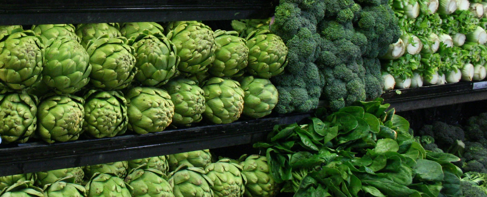 produce displayed nicely on shelves at a store