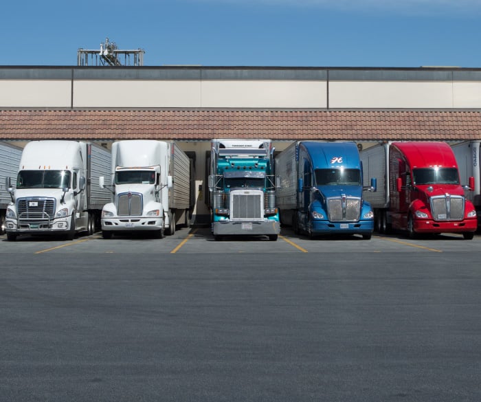 Trucks parked in front of facility