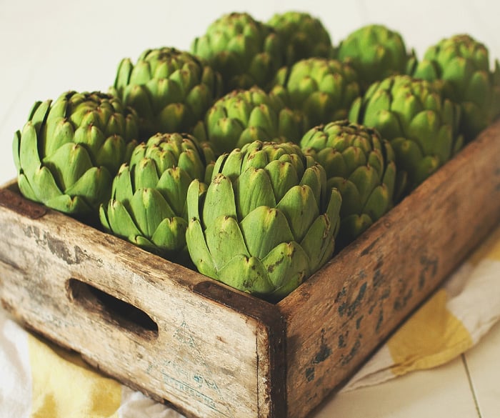 Wooden crate of artichokes
