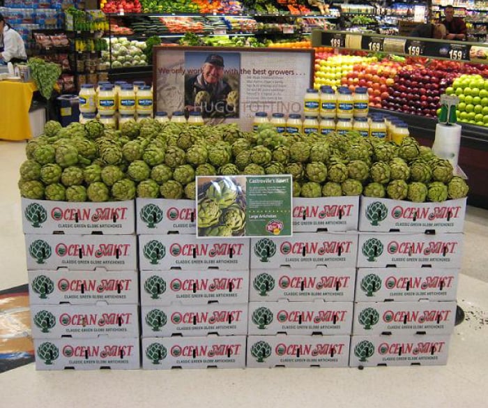 Cartons of artichokes in grocery store